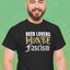 Beer Lovers Hate Fascism T-Shirt worn by a smiling man against a green background, featuring bold text.