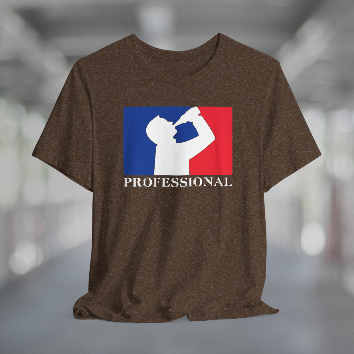 Heather brown t-shirt with white silhouette of man drinking beer with red and blue background, like professional sports logo, and word Professional underneath.