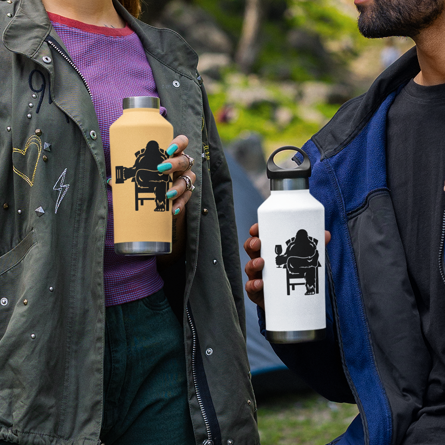 Two people holding water bottles with decal of Bigfoot relaxing in a chair, holding a beer mug and a wine glass.