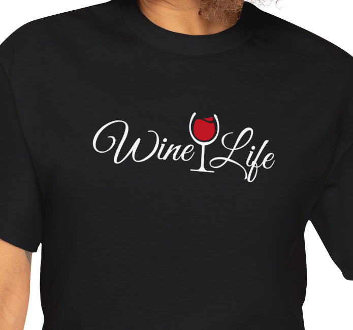 Woman wearing black t-shirt with wine life written in swirly script letters, and a glass of red wine