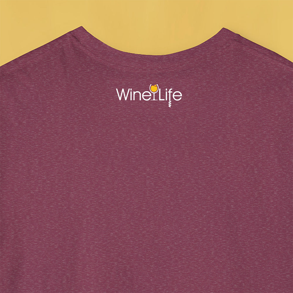 Back neckline of Heather red maroon t-shirt with wine life written in swirly script letters, and a glass of golden yellow white wine