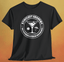 Stirfleet Academy Front Logo T-Shirt featuring a logo with a cocktail and umbrellas on a black shirt.