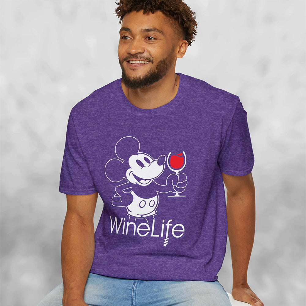 Smiling man wearing Heather purple t-shirt with a mouse drinking a glass of red wine, with the Wine Life logo below