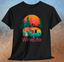 Wine Life Camping T-Shirt featuring a colorful camper design on a black short sleeve t-shirt.