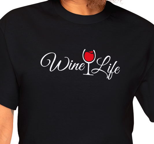 Woman wearing black t-shirt, white Wine Life logo with script styled letters, and wine glass full of red wine.