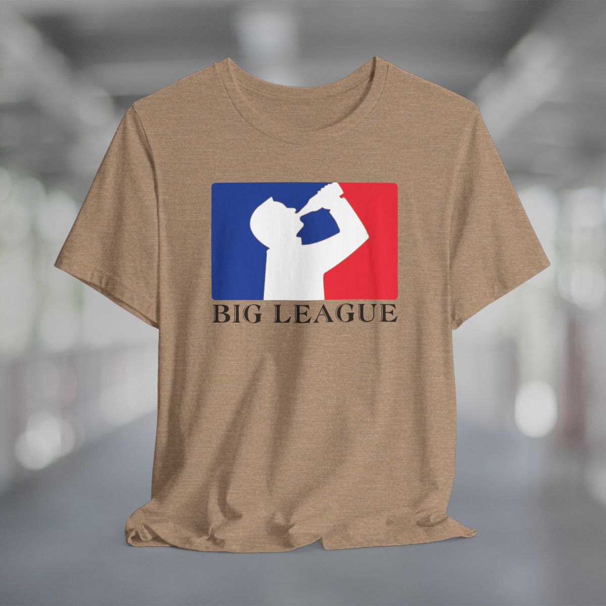 Heather tan t-shirt with white silhouette of man drinking beer with red and blue background, like professional sports logo, and words Big League underneath