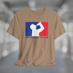 Heather tan t-shirt with white silhouette of man drinking beer with red and blue background, like professional sports logo, and words Drinking Team underneath