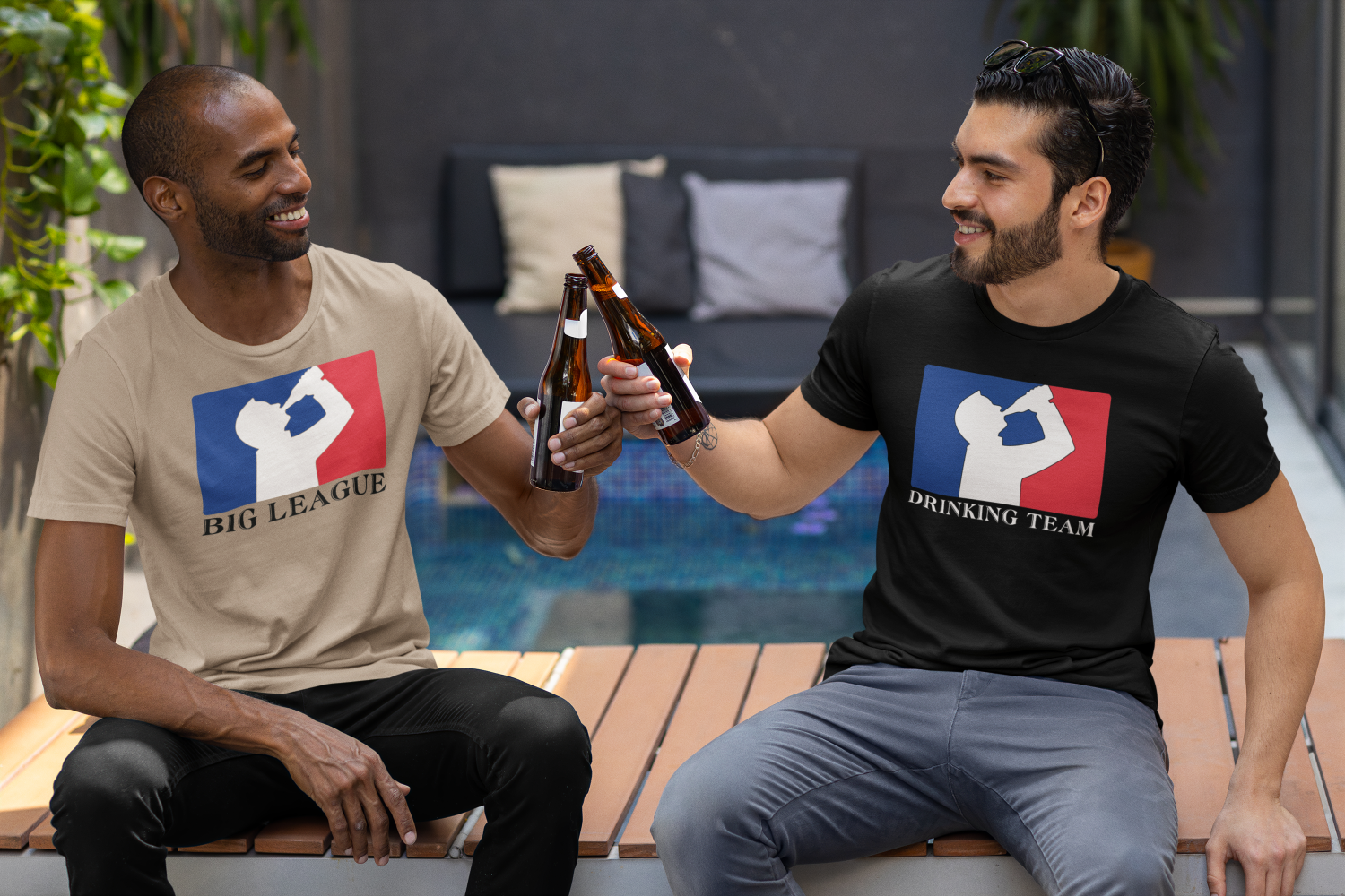 Two men drinking beer wearing t-shirt with white silhouette of man drinking beer with red and blue background, like professional sports logo.