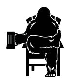 black decal of Bigfoot relaxing in a chair holding a beer mug.