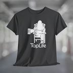 Heather charcoal gray t-shirt with white graphic of Bigfoot holding a beer mug, sitting in a lawn chair with leg crossed in relaxed position, Tap Life logo below.