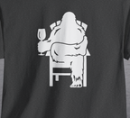 Charcoal gray shirt with graphic design of Bigfoot holding a wine glass, while sitting in a lawn chair relaxing