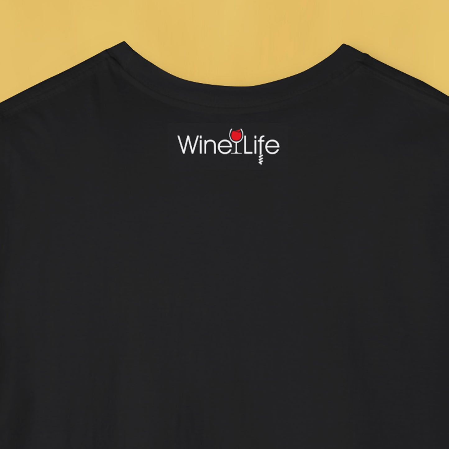 'Wine Life' logo on the back neckline of a black t-shirt with a yellow background