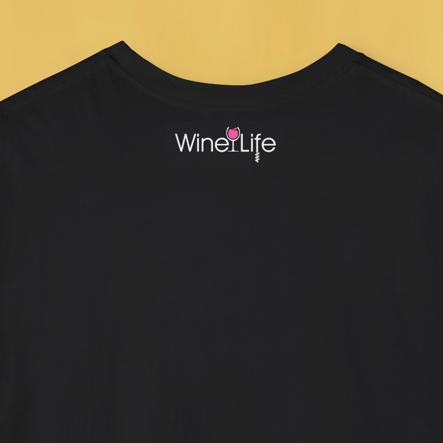 Back neckline of black t-shirt with wine life logo and pink rose' wine glass and corkscrew