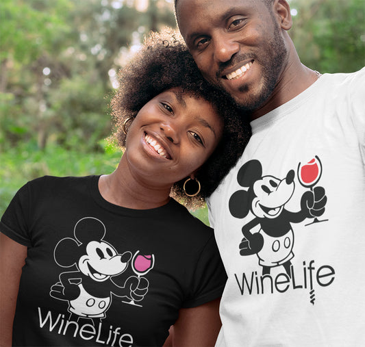 A cute couple wearing black and white shirts, with a mouse drinking a glass of red and rose wine