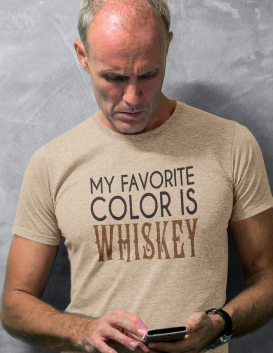 Man wearing heather tan t-shirt with black text My Favorite Color is Whiskey