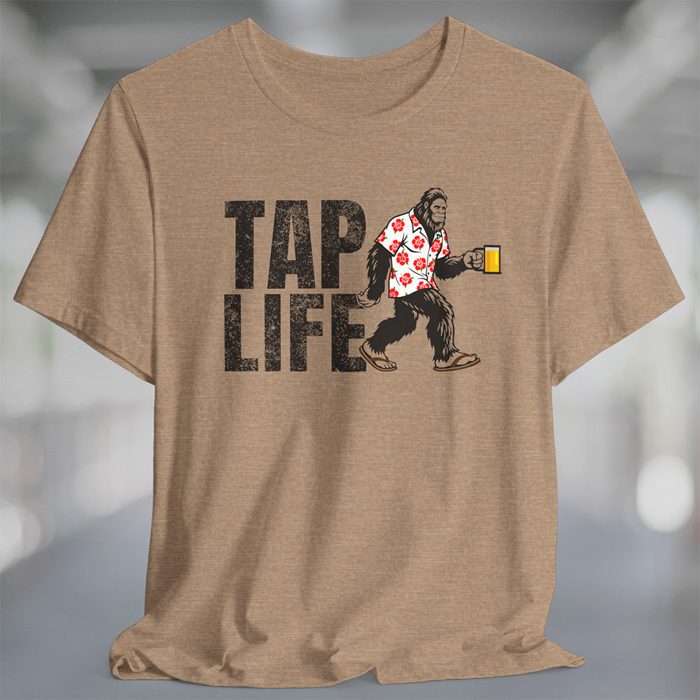 Heather tan t-shirt with 'Tap Life' text and Bigfoot wearing a Hawaiian shirt and holding a beer
