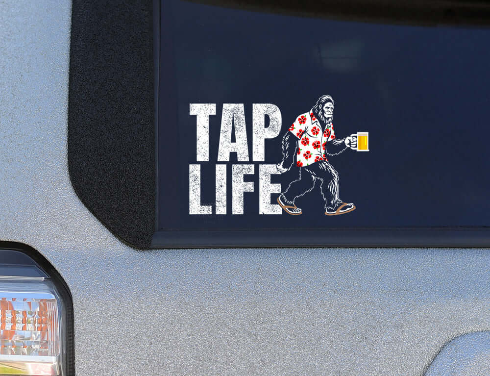 Hawaiian Bigfoot Beer Car Window Decal featuring Bigfoot with beer and Hawaiian shirt, TAP LIFE theme. Main image