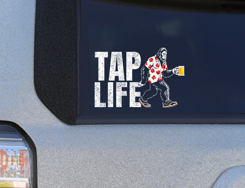 Sticker on car window with 'Tap Life' and a Bigfoot holding a beer