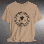 Heather tan t-shirt, with black United Federation of Beverages Stirfleet Academy logo, martini glass ice cube umbrella graphic on front of shirt.