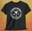 Black t-shirt, with white United Federation of Beverages Stirfleet Academy logo, martini glass ice cube umbrella graphic on front of shirt.