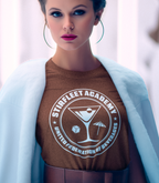 Futuristic woman wearing brown shirt with United Federation of Beverages Stirfleet Academy logo, white graphic design with martini glass, ice cube, and umbrella