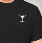 Man wearing black shirt with United Federation of Beverages Stirfleet Command martini logo, small white graphic design on front breast.