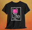A black t-shirt with a Wine Life logo and a pink wine glass inside a rectangle.