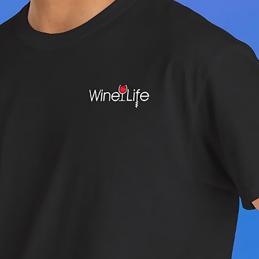 Close up of man wearing  t-shirt with Wine Life logo on front chest, with red wine glass and corkscrew