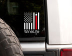 Rear window with white decal of American flag with one red stripe pouring from a wine glass, Wine Life logo below