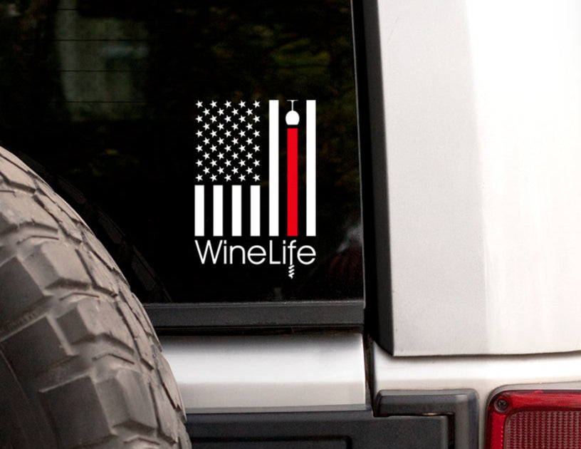 Rear window with white decal of American flag with one red stripe pouring from a wine glass, Wine Life logo below