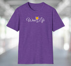 Heather purple t-shirt with wine life written in swirly script letters, and a glass of golden yellow white wine