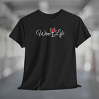 Black t-shirt, white Wine Life logo with script styled letters, and wine glass full of red wine.