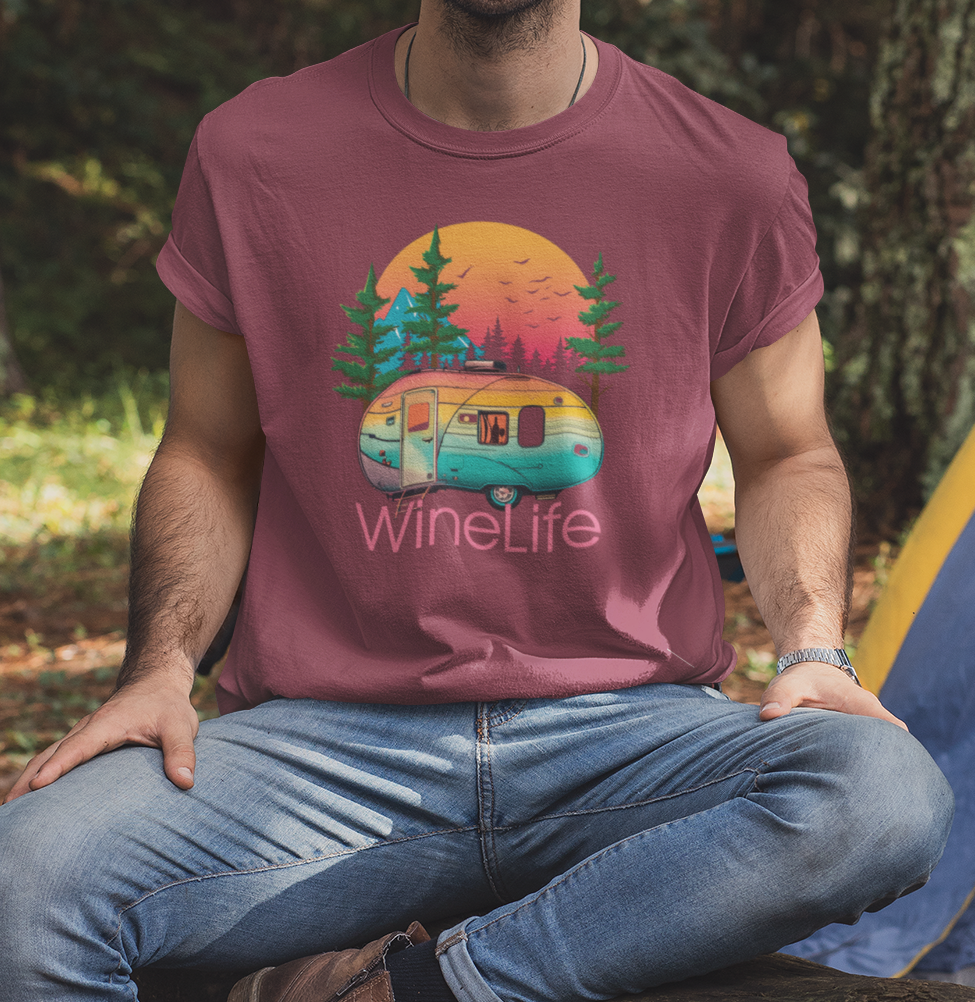Man wearing heather red maroon t-shirt with wine life camping graphic design, colorful camper with background of trees, mountains, sun and birds, above wine life logo