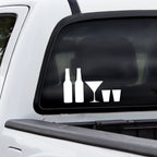 Rear window of a truck with stick family decals of solid white beer bottles, martini glass, and shot glasses